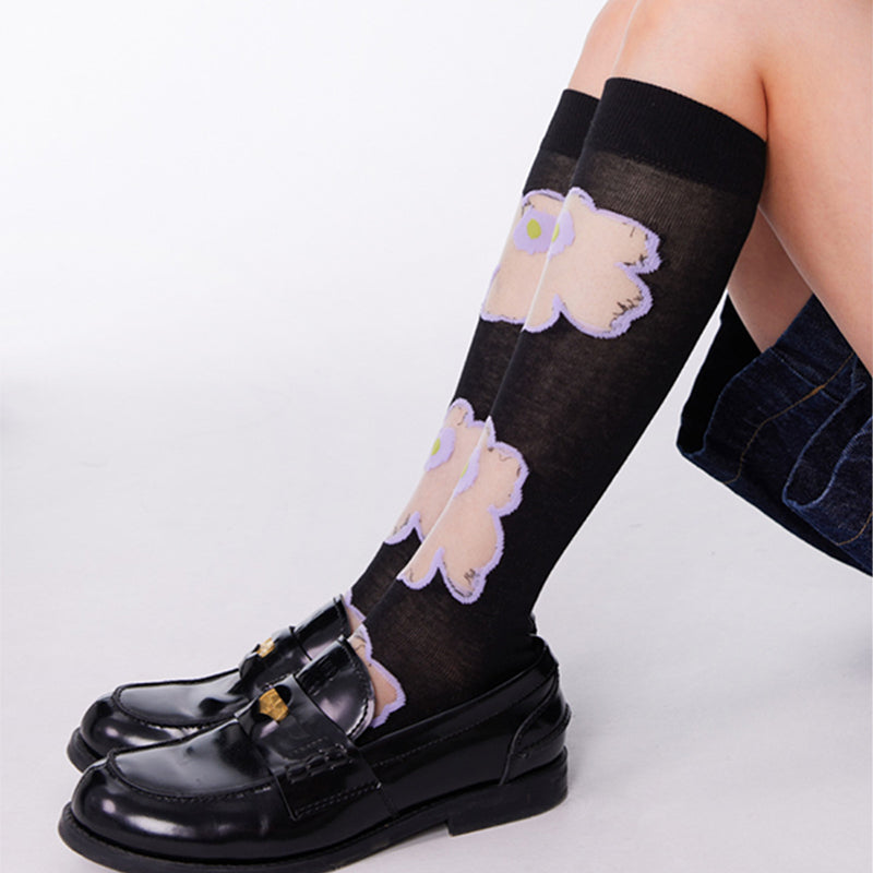 Transparente Socken aus Glas mit Blumenmuster in Lila