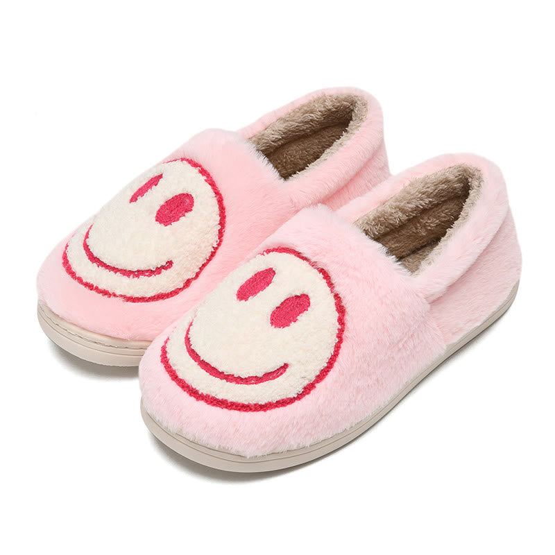 Bunte Hausschuhe mit Smiley-Gesicht in Übergröße