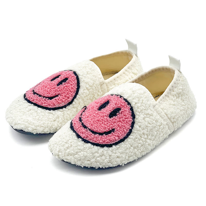 Rosa Hausschuhe mit Smiley-Motiv in Übergröße