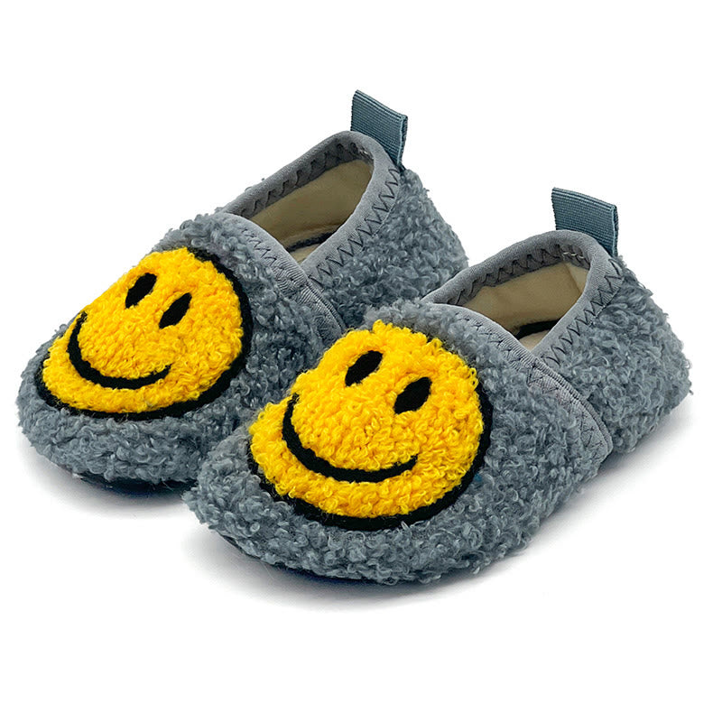 Rosa Hausschuhe mit Smiley-Motiv in Übergröße