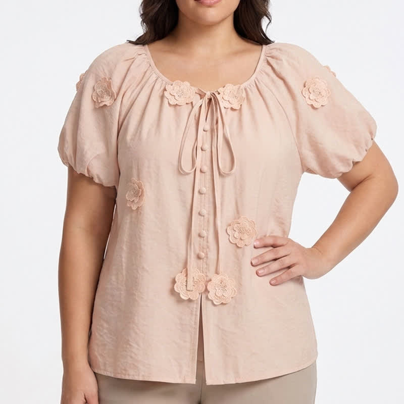 Bluse mit floralen Applikationen, Puffärmeln und Bindeband vorne - image 1